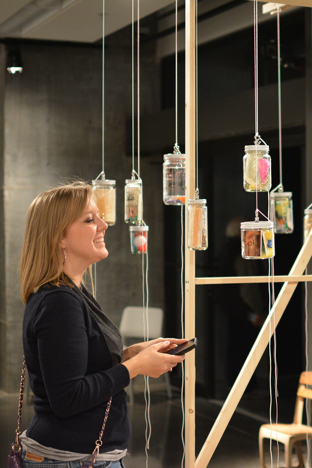A visitor is so happy after takeing part in helping to create the installation.